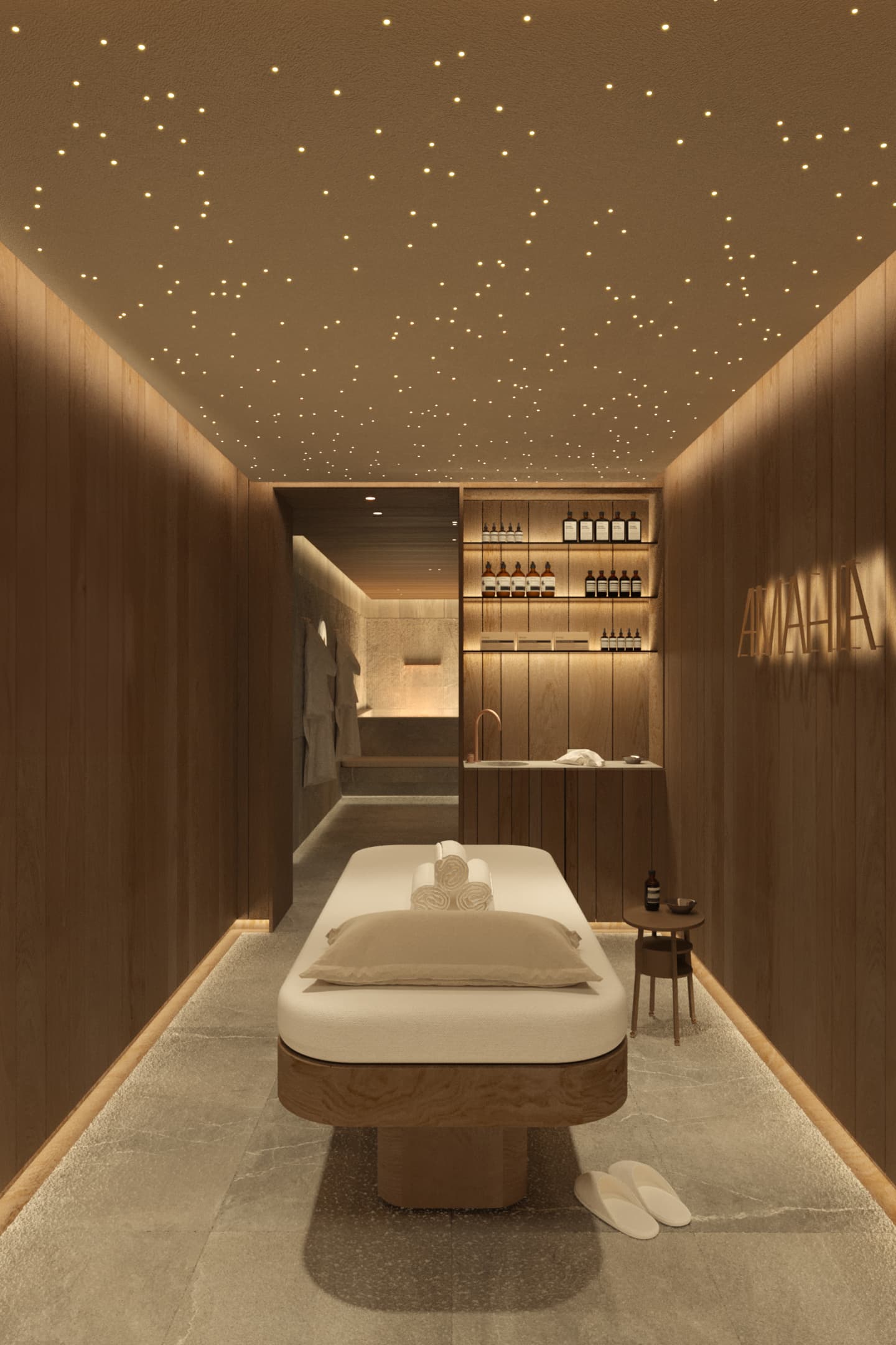 La sala massaggi con lettino, pareti in legno e soffitto illuminato da piccoli punti luce.